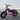 AR Atom mini electric bicycle in pink with fat tires against an urban backdrop.