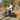 Man riding a Hiboy EX6 Step-Through fat tire electric bike on a nature trail with autumn leaves.
