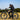 Hiboy P6 fat tire electric bike in action with rider on a sunny outdoor terrain.