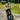 Man riding a Hiboy P6 fat tire electric bike on a dirt path, wearing a blue helmet and patriotic shirt.