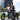 Couple smiling while riding Hiboy EX6 Step-Through Fat Tire Electric Bikes in an urban setting.