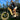 Man riding Rundeer Attack10 off road electric bike with fat tires, showing powerful 1000W motor and sleek design in a park setting.