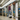 Man carrying Inmotion E20 Dual Wheel electric unicycle while entering a subway station.