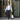 Man in business attire using the Inmotion E20 Dual Wheel electric unicycle outside a modern building.