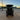 Rear view of TrailMaster TBM X6 6-seater electric golf cart with foldable windshield at sunset in an industrial area.