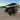 TrailMaster TBM X6 6-seater electric golf cart with foldable windshield and 22-inch rims, parked on a concrete surface at sunset.