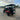 Red TrailMaster TBM X6 6-seater electric golf cart with 22” aluminum rims and foldable windshield in an outdoor parking area.