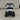 Front view of TrailMaster TBM X6 electric golf cart with 22” aluminum rims and foldable windshield.