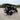 TrailMaster TBM X6 electric 6-seater golf cart with 5kW lithium battery in outdoor setting, showcasing aluminum rims and foldable windshield.