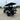 TrailMaster TBM X6 electric golf cart with 6 seats, showcasing 22-inch rims, foldable windshield, and rear view in parking lot.