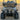 Front view of TrailMaster TBM X6 electric golf cart with 22-inch aluminum rims and LED headlights on a concrete surface.