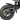 Close-up of BurroMax TT1600R's rear wheel and disc brake system with treaded tire and carbon fiber fender.