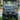 TrailMaster Taurus 50EV 4-seat electric golf cart with 60V motor and DOT light package parked on grass.