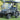 TrailMaster Taurus 50EV electric golf cart with DOT light package, aluminum wheels, off-road tires, and digital dashboard.