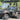 TrailMaster Taurus 50EV 4-Seat Electric Golf Cart with 60V motor, aluminum wheels, and DOT light package on paved road.
