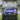 TrailMaster Taurus 50EV electric golf cart with 60V motor, full DOT light package, and off-road tires on grass.