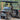 TrailMaster Taurus 50EV 4-seat electric golf cart with 60V motor, off-road tires, and DOT light package on outdoor path.