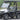 TrailMaster Taurus 50EV 4-seat electric golf cart with 60V motor and DOT light package, aluminum wheels, and off-road tires.