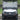 TrailMaster Taurus 50EV electric golf cart with DOT light package, aluminum wheels, and off-road tires, front view.