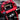 Close-up of the Extreme Bull Commander GT's striking red frame and LED lights.