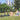 Couple enjoying a picnic with Hiboy S2 SE Electric Scooters in a sunny park setting.