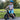 Smiling boy wearing a helmet riding the Hiboy BK1 Electric Balance Bike on a sunny day.