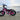 AR Atom 1000 Watt Mini Electric Bicycle in vibrant pink parked by the waterfront, showcasing its robust design.