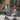 A woman on the Inmotion E20 electric unicycle interacts with a man and their dog outdoors.