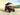 TrailMaster TBM X6 6-seater electric golf cart with 48v lithium battery, foldable windshield, and 22” aluminum rims.