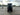 Rear view of TrailMaster TBM X6 6-seater electric golf cart in an empty parking lot