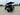 TrailMaster TBM X6 electric golf cart with 6 seats, showcasing 22-inch rims, foldable windshield, and rear view in parking lot.