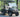 TrailMaster Taurus 50EV 4-seat electric golf cart with DOT light package and off-road tires, showcasing design and features.