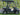 TrailMaster Taurus 50EV 4-Seat Electric Golf Cart with aluminum wheels and off-road tires, featuring full DOT light package.