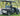 TrailMaster Taurus 50EV 4-Seat Electric Golf Cart with off-road tires and 60V motor, featuring full DOT light package.