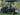 TrailMaster Taurus 50EV electric golf cart with 4 seats, aluminum wheels, DOT lights, and 60V motor for off-road use.
