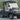 TrailMaster Taurus 50EV 4-seat electric golf cart with DOT light package, aluminum wheels, off-road tires, and digital dashboard.