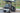 TrailMaster Taurus 50EV 4-seat electric golf cart with aluminum wheels and off-road tires.