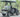 TrailMaster Taurus 50EV 4-seat electric golf cart with 60V motor, aluminum wheels, off-road tires, LED headlights, side mirrors.
