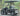 TrailMaster Taurus 50EV 4-Seat Electric Golf Cart with 60V motor, DOT light package, aluminum wheels, and off-road tires.