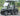 TrailMaster Taurus 50EV 4-seat electric golf cart with 60V motor, off-road tires, and DOT light package, parked outdoors.