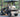 TrailMaster Taurus 50EV electric golf cart, 4-seat, featuring 60V motor, aluminum wheels, and DOT light package in outdoor setting.