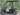 TrailMaster Taurus 50EV four-seat electric golf cart with 60V motor, aluminum wheels, and DOT lights on a sunny day.