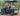 TrailMaster Taurus 50EV 60V electric golf cart with 4 seats, DOT lights, off-road tires, and digital dashboard parked outdoors.