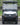 TrailMaster Taurus 50EV electric golf cart with DOT light package, aluminum wheels, and off-road tires, front view.