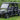 TrailMaster Taurus 80ED-GV 6-seat electric golf cart with an extended roof on grass, showing front and side views
