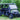 TrailMaster Taurus 80ED-U 4-Seat Electric Golf Cart with dump bed, aluminum alloy wheels, and off-road tires, parked on grass.