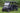TrailMaster Taurus 80ED-U 4-Seat Electric Golf Cart with 72V Motor and Aluminum Wheels, parked on grass