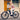 Young woman riding Rundeer Starry Sky UD carbon fiber electric bike on the street, showcasing eco-friendly urban commuting.